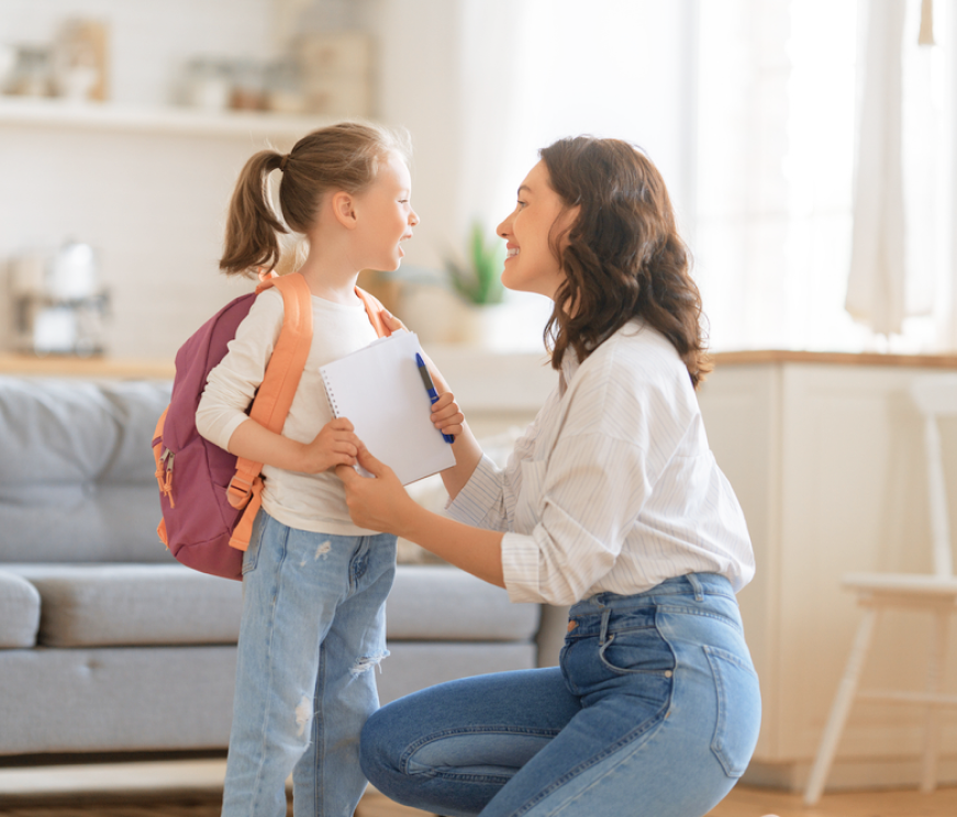 Mother preparing child for school